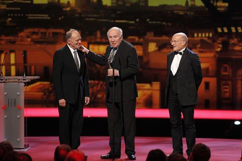 Bruno Ganz (left) and Volker Schlondorff (left) present Michel Piccoli with a surprise award